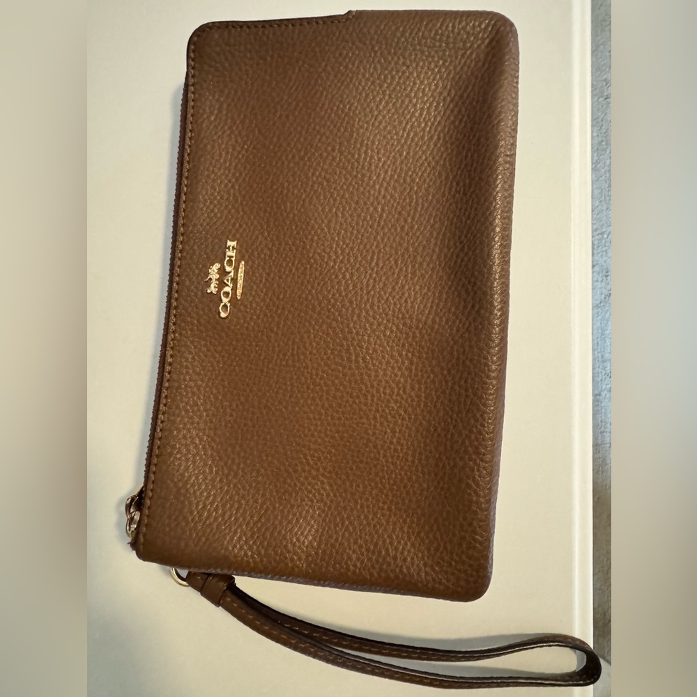 Coach wristlet, two pockets, clean, zippers work, hardly used